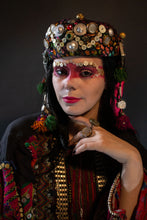 Load image into Gallery viewer, Upcycled vintage pillbox hat maximalized with heirloom mother-of-pearl buttons, silver Afghan clothing ornaments, antique Pashtun silver triangular ornaments and Afghani tent band tassels with silver.