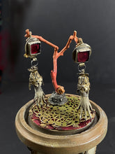 Load image into Gallery viewer, Closeup of designed earrings and metalwork detail on the base.