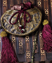 Load image into Gallery viewer, Brass Sufi kashkul reimagined as an evening bag, with silk sari lining, tassels; drawstring closure; beaded strap.
