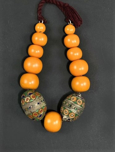 Necklace of pressed amber and silver enamel beads