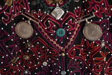 Load image into Gallery viewer, Closeup vew of coin, bead, and distinctive embroidery on Kohistani tunic.
