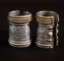 Load image into Gallery viewer, Pair of brass and silver Swat Valley cufs showing detail work

