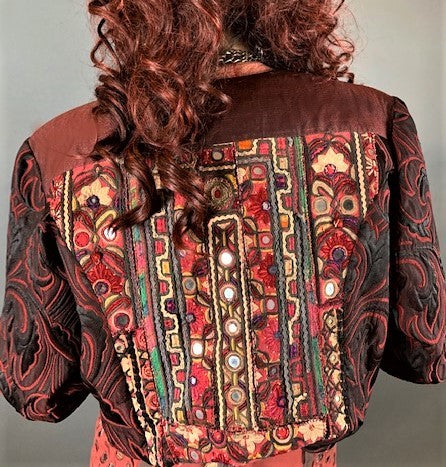 Back view of jacket showing embroidery, button and applique work.