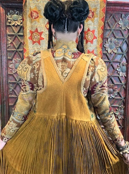 Vintage Rumanian wool vest, heavy accordion pleat, back view.