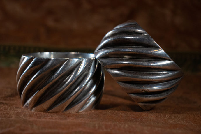 Side view of the pair of Moroccan silver cuffs.