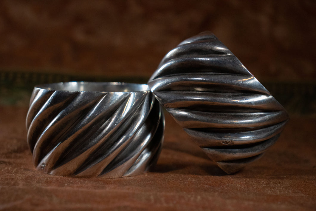 Side view of the pair of Moroccan silver cuffs.
