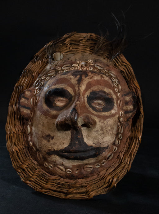 Ancestor mask on turtle shell