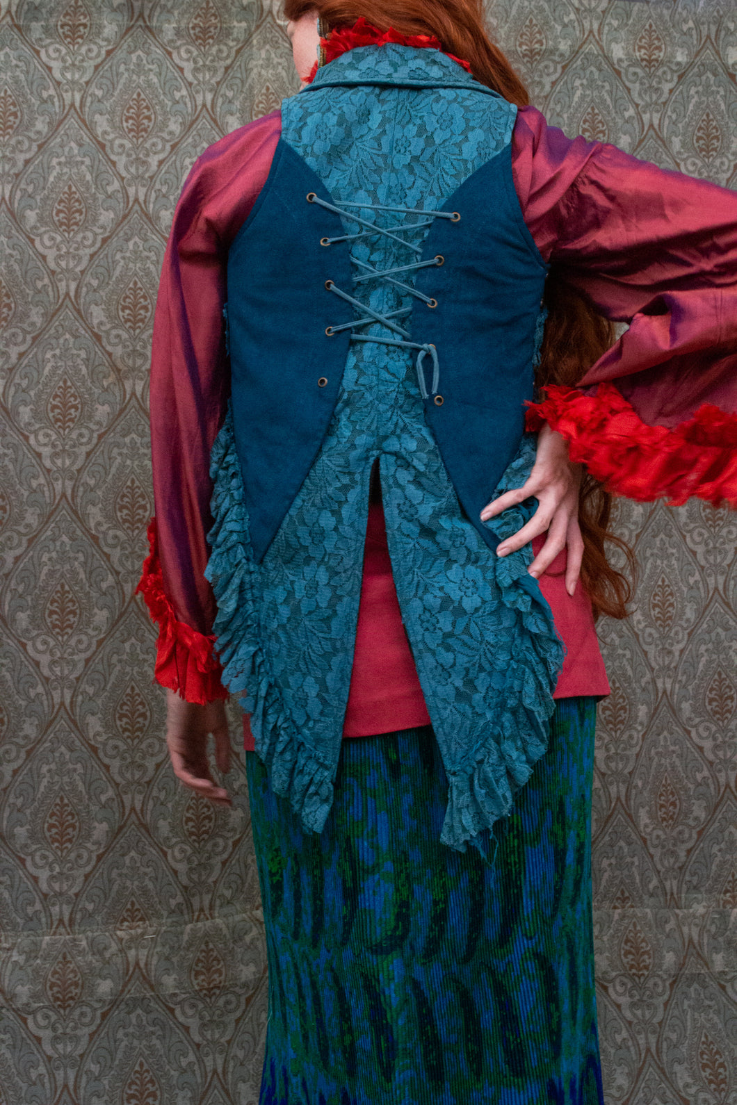 Back view of vest showing lace-up and fringe