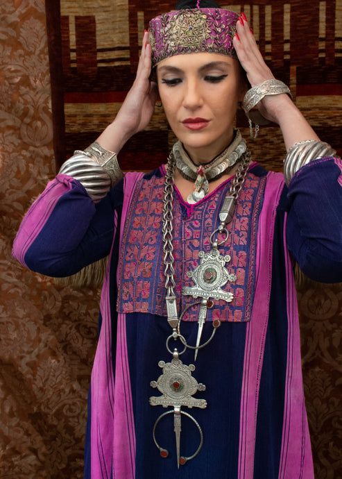 Large silver fibulae worn as a statement necklace