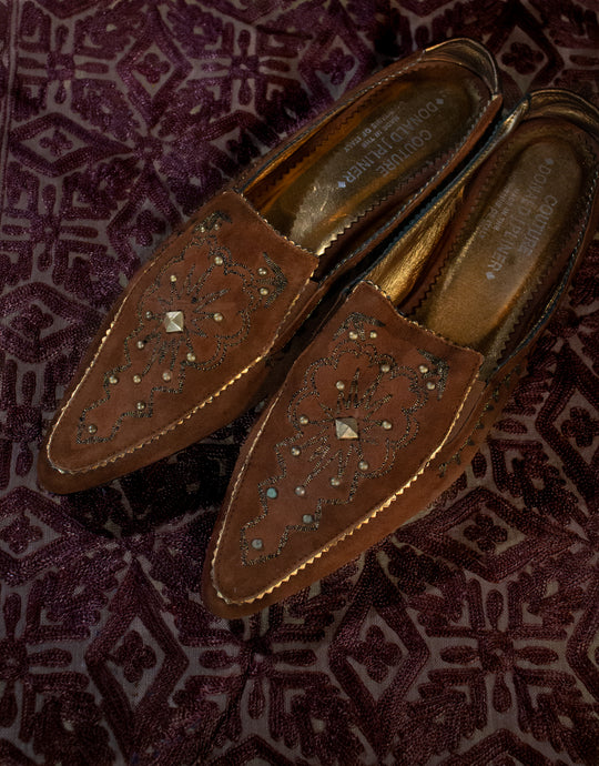 Beautiful detail work on suede mules