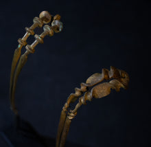 Load image into Gallery viewer, Detail of decorative ends on Liao Dynasty hair sticks
