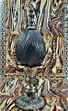 Load image into Gallery viewer, Closer view of stone egg object, showing deep curved etching in the stone.
