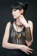 Load image into Gallery viewer, Naga slinky coil bracelet of brass on model
